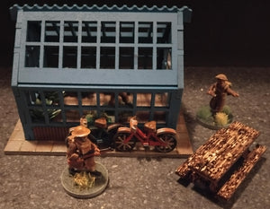 Green house with bicycles, flower boxes and a garden table